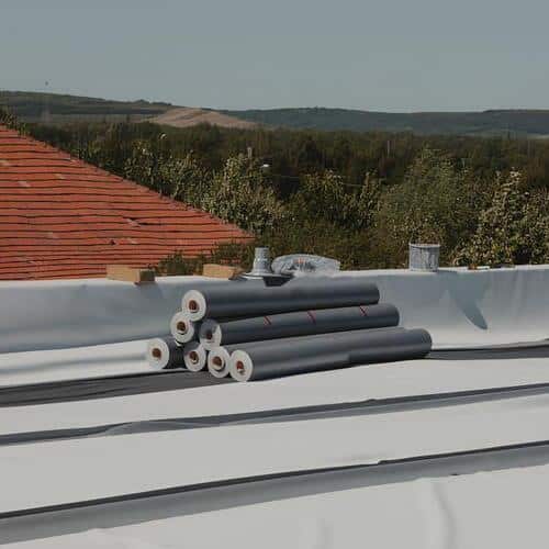 rolls of PVC membrane on a flat roofing system