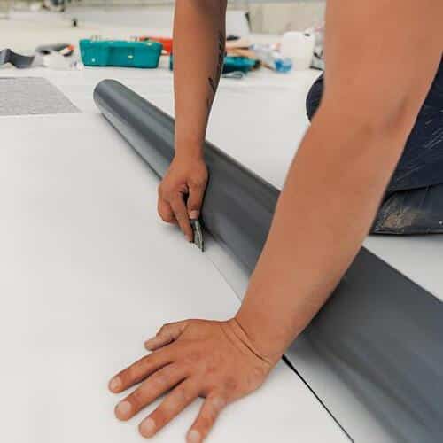 closeup of TPO roofing being installed