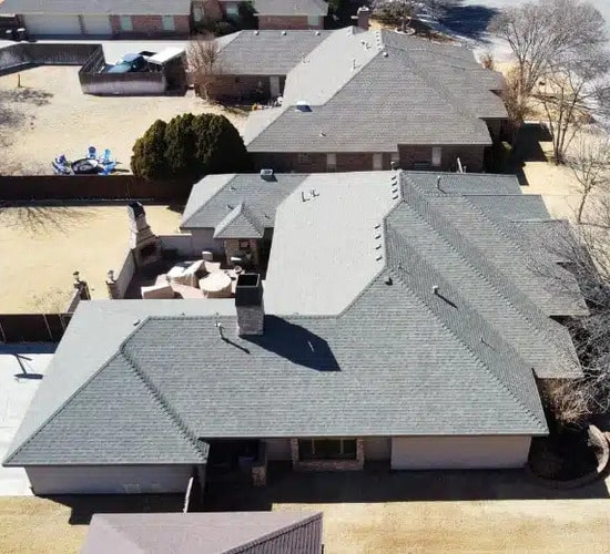 aerial view of homes with shingle roofing